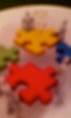 3-d red yellow puzzle people (E&I)